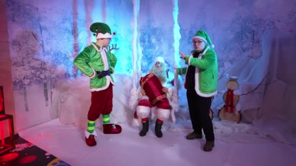 Two Helper Elves Santa Happily Dance Snowy Room — Vídeo de Stock
