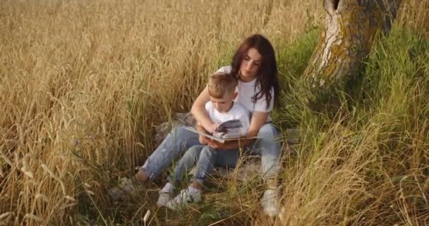 Mother Reads Interesting Book Fairy Tales Her Child — Wideo stockowe