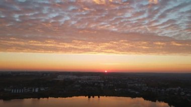 Sunrise with beautiful clouds in the city. Aerial shot. High quality 4k footage