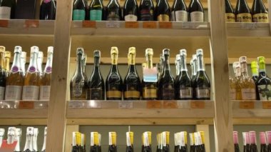 Alcoholic products of expensive brands are displayed for sale