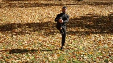 Man stretching leg muscles nature