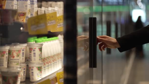 Womans Hand Chooses Dairy Products While Shopping Supermarket Client Opens — Vídeo de Stock