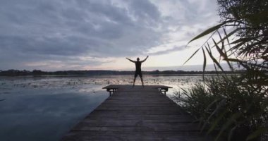 Sportsman doing cardio training on the beach in the morning before sunset