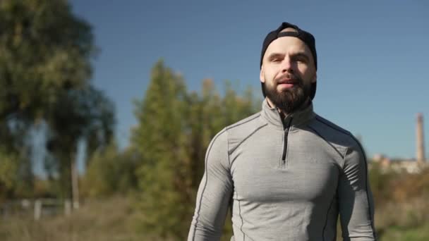 Athletic Man Sportswear Walking Park Outdoors Resting Catching His Breath — Vídeo de Stock