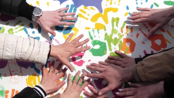Close Many Childrens Hands Making Colorful Palm Prints White Wall — Stock Video