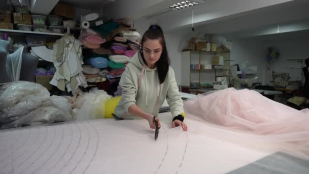 Fashion Designer Cuts Fabric Laid Out Table According Patterns Scissors — Vídeos de Stock