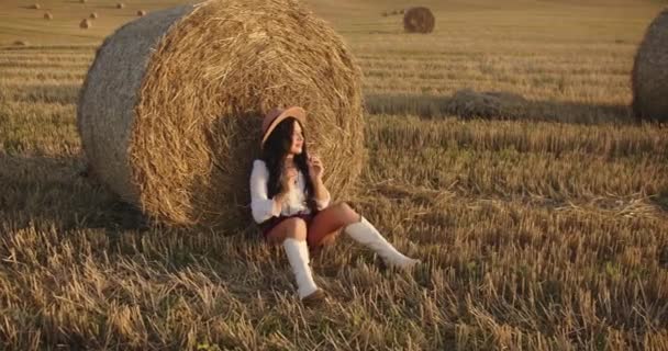 Girl Rests Haystack — Wideo stockowe