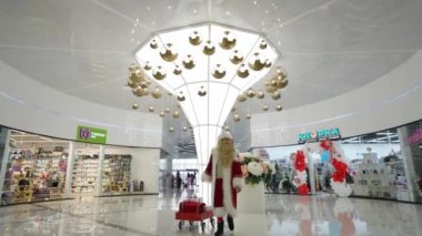 Interior of a large modern shopping center. Decorative compositions, modern design details. Entertainment for children and adults