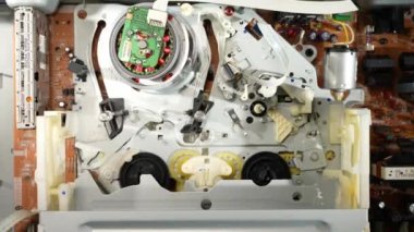 VHS video recorder, pulling the video film onto the reading head