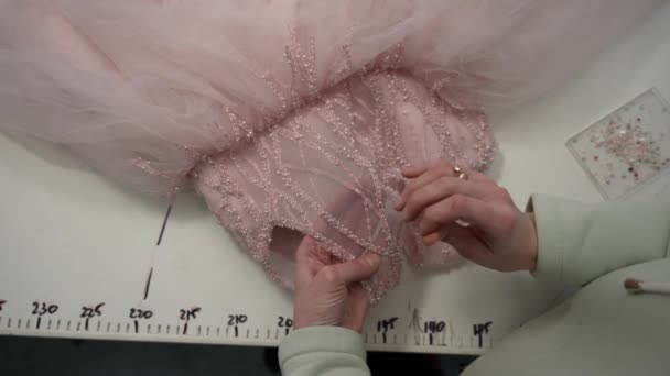 Seamstress Decorates Holiday Dress Hand Sewing Rhinestones Beads — Vídeos de Stock
