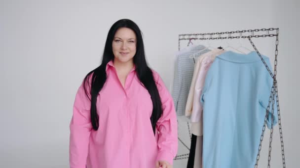 Cute Brunette Stylist Has Chosen Clothes Your Wardrobe — Stock Video