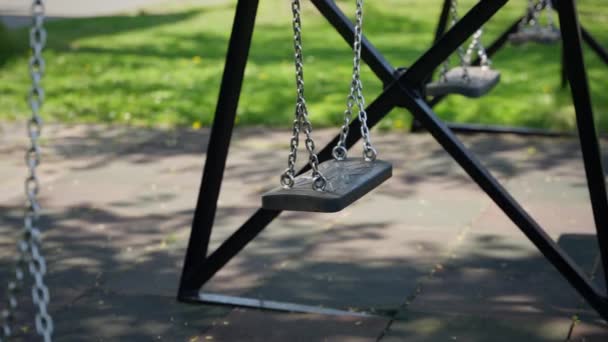 Close Empty Childrens Swing Park Which Attached Chain — Stock Video
