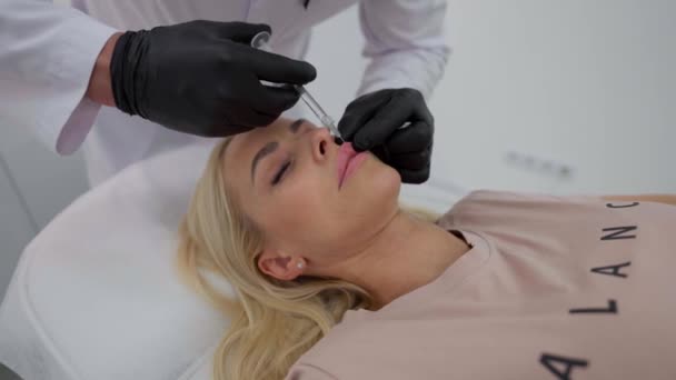 Girl Receives Beauty Injection Her Lips Close Cosmetologists Hands Making — Stock Video