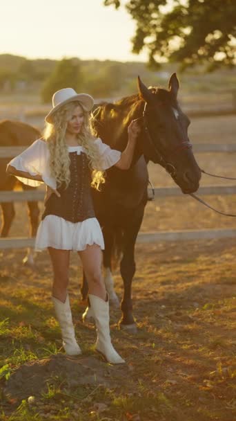 Young Girl Holds Horse Bridle Sunset Summer — Stock Video