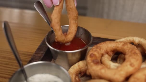 Onion Rings Fried Flour Red White Sauce Laid Out Wooden — Stock Video