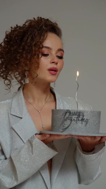 Beautiful Girl Blows Out Burning Candle Birthday Cake — Stock Video