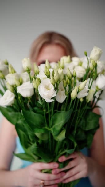Delicate Hands Clasp Lush Bouquet White Lisianthus Blooms Focus Soft — Stock Video