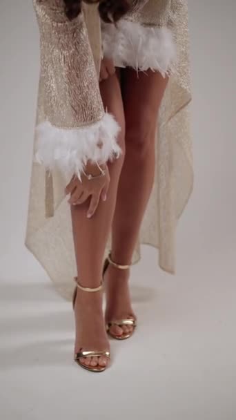 Focuses Graceful Touch Womans Hands Her Feather Trimmed Golden Robe — Stock Video