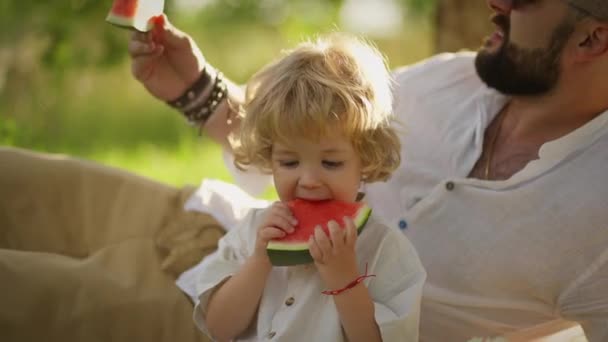 Man Shows Piece Watermelon Baby Eats Appetite Happy Moments Nature — Stock Video