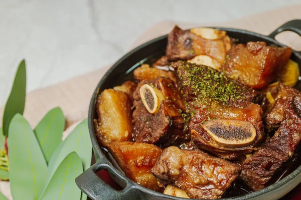 stock image Beef short ribs, trimmed of fat, seasoned in sweet soy sauce, and braised until tender with carrots, chestnuts, ginko nuts, and other vegetables.