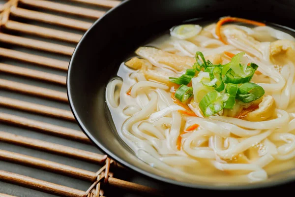 Kalguksu, Korean style noodle soup :Fresh knife-cut noodles, made by rolling flour dough and slicing into thin noodles, cooked in anchovy sauce. Zucchini, potatoes, and seafood may beadded.