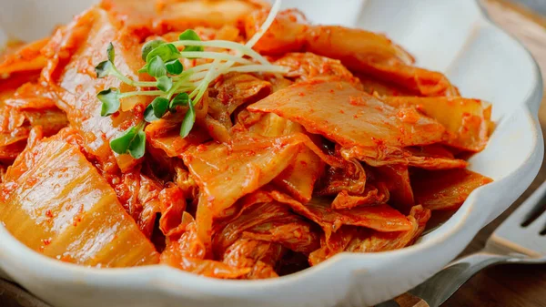 Well-fermented kimchi stir-fried with chopped green onion and garlic in a pan greased with oil, this is a popular side dish usually eaten with rice. It also goes well with bean curd.