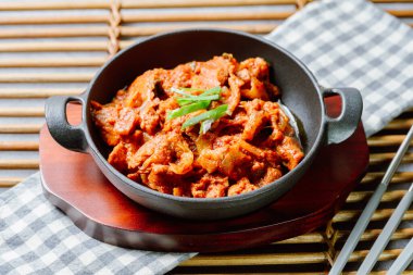 jeyukbokkeum, Korean style stir-fried pork : Thinly sliced pork marinated in spicy ginger-gochujang and stir-fried with onion, carrots, perilla leaves, or abbage. Ingredients vary according to taste.