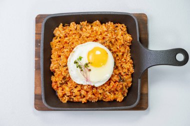 Kimchibokkeumbap, Korean Kimchi Fried Rice : Rice fried with finely chopped kimchi. Beef, pork, onions, green onions, and other vegetables may be added according to taste.Kimchibokkeumbap, Korean Kimchi Fried Rice : Rice fried with finely chopped kim