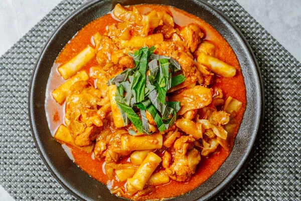 stock image Dakgalbi, korean style Spicy Stir-fried Chicken with rice cake, Chicken pieces marinated in a gochujang, and stir-fried in a flat grill pan with cabbage, sweet potato, carrots, and tteok (rice cakes). A local dish of Chuncheon city in Gangwon Provinc