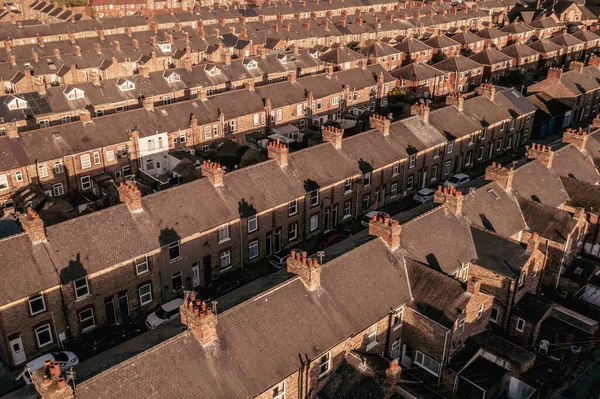 Aerial view of old and run down terraced houses on back to back streets in the suburbs of a large UK city in the North of England