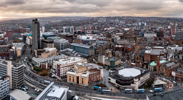 stock image SHEFFIELD, UK - DECEMBER 6, 2022.  An aerial panorama of Sheffield city centre cityscape skyline at sunset with The Arts Tower and Crucible Theatre in the retail district