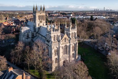 SELBY, NORTH YORKSHIRE, UK - JANUARY 16, 2023.  An aerial view of the Yorkshire market town of Selby with the ancient architecture of Selby Abbey prominent