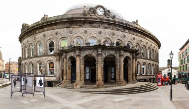 LEEDS CORN EXCHANGE, LEEDS, UK - FEBRUARY 17, 2023.  A landscape view of the front facade of Leeds Corn Exchange with ornate Victorian architecture clipart