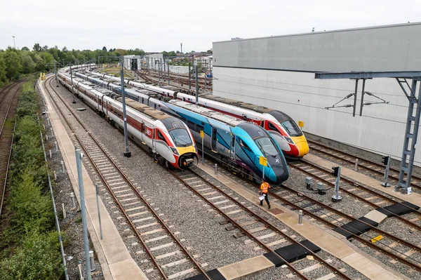 stock image DONCASTER, UK - MAY 13, 2023.  Aerial view of a fleet of Hitachi high speed passenger trains in Trans Pennine Express and LNER livery on the Hitachi Maintenance Depot in Doncaster