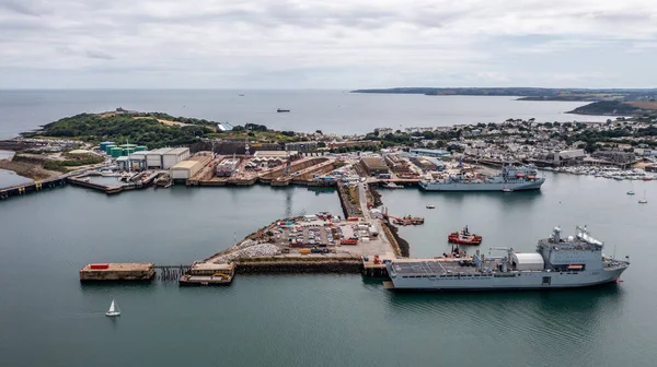 stock image FALMOUTH, CORNWALL, UK - JULY 5, 2023.  Aerial landscape panorama view of the docks and harbour in Falmouth with Royal Navy fleet auxillary ships docked for resupply