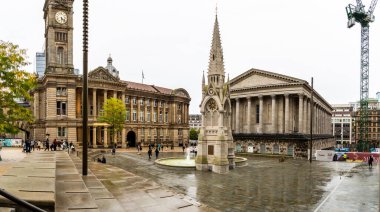 CHAMBERLAIN SQUARE, BIRMINGHAM, UK - OCTOBER 2, 2023. landscape of Birmingham's historic Council House and Town Hall building with the Chamberlain Memorial in Chamberlain Square, UK clipart