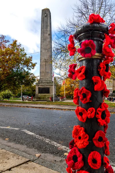 Vertical panorama of The Cenotaph and War Memorial remembering the fallen soldiers of World War at Prospect Square in Harrogate town centre with hamemade poppies