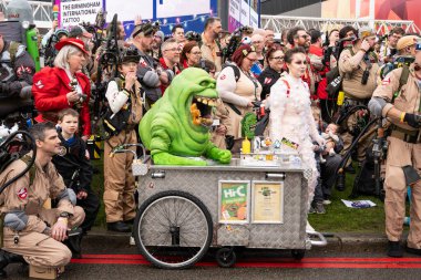 BIRMINGHAM, UK - NOVEMBER 30, 2024. A large group of cosplayers dressed as Ghostbusters at a UK comic con event in the UK clipart