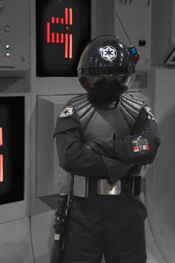 BIRMINGHAM, UK - NOVEMBER 30, 2024.  A portrait of a male cosplayer dressed as an Imperial engineer or guard from the Star Wars movie franchise at a UK Comic Con on board The Death Star clipart