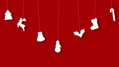 Kağıt, kırmızı arka planda asılı Noel dekoratif unsurlarını kesti
