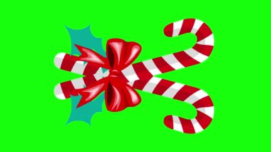 Kırmızı kurdele ve şeker kamışları yeşil arka planda hareket ediyor