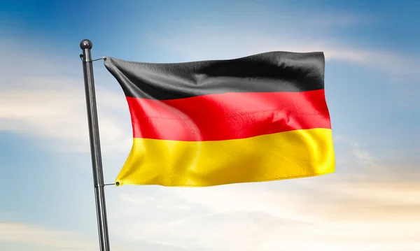 Germany flag waving on sky background. 3D Rendering