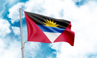 Antigua and Barbuda flag waving on sky background. 3D Rendering