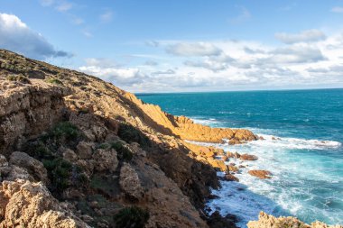 Port aux Princes, Tunisia, Cliffs and Rocks, Mediterranean Sea landscape with beautiful blue sky. Heavenly Escape. Takelsa