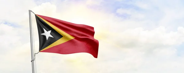 Östtimors Flagga Viftar Himlen Bakgrund Återgivning — Stockfoto