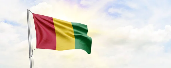 Guinea Flag Waving Sky Background Rendering — Zdjęcie stockowe