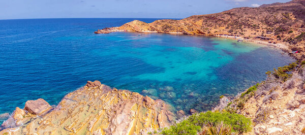 Deserted Haven: Ain Kanassira's Beach Nestled Between Sea and Mo