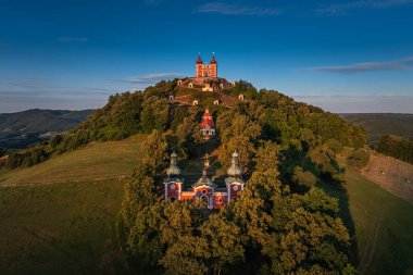 Banska Stiavnica, Slovakia - Aerial view of the beautiful Baroque Calvary in Slovakia at sunset on a summer afternoon with clear blue sky at background clipart