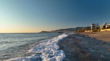 sea filmed on a drone in the sunset