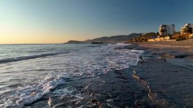 sea filmed on a drone in the sunset